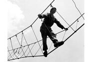 A bit wobbly but easy method of crossing ravines and rivers is this three rope bridge. An instructor shows the proper way of crossing. 