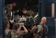 Airmen move a mock victim during the transportation stage of a training exercise in 2005 at Yokota Air Force base.