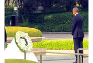 President Barack Obama stands for a moment of silence after laying a wreath at Hiroshima Peace Memorial Park on May 27, 2016.