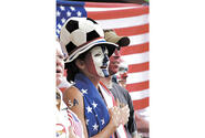 U.S. Army Capt. Misty Cornett sings the National Anthem at the start of the USA vs. South Korea World Cup game held in Taegu, South Korea.