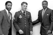 Cardinals players Ozzie Smith, left, and Vince Coleman, right, pose for a photo with Sgt. David Morse of Camp Zama in January, 1988.