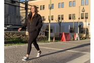 Navy Petty Officer 1st Class Caroline Crumbacker walks at Naval Support Activity Naples, Italy.
