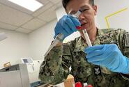 A hospital corpsman processes biological samples during a U.S. Naval Medical Research Unit Indo Pacific study on natural- and vaccine-derived immunity of respiratory diseases in U.S. sailors and Marines in September 2023.