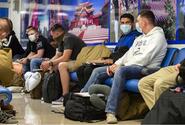 Marines wait inside the passenger terminal at Kadena Air Base, Okinawa, June 6, 2020.