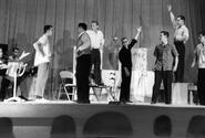 A crew unloads set pieces for the 7th Infantry Division Special Services “soldier show,” to be performed later that day in Seoul, South Korea. After touring various bases and venues throughout Korea in September 1956, the show would move to perform in Japan the next month.