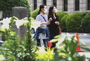 Women wear masks while out and about in Yokohama, Japan, May 24, 2021.