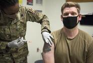 A service member receives the Moderna COVID-19 vaccine late last year at Kunsan Air Base, South Korea. Off base, 32% of the country’s 51 million residents have received the first dose of a vaccine as of Wednesday, July 21, 2021.